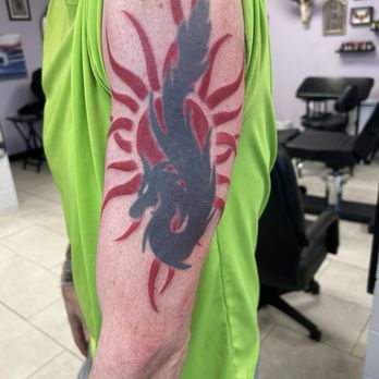 Apollo Beach Tattoo Company  - Touched up my Godsmack sun from 20+ years ago.  Dragon is next.  3/22/25 - Tattoo Near Me - Apollo Beach, Florida