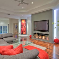 Audio & Communications Experts - TV recessed in-wall, invisible speakers, all controlled by iPad, Lutron RadioRA2 lighting control.