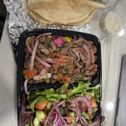 Beef shawarma plate with rice, salad, and pita. Delicious