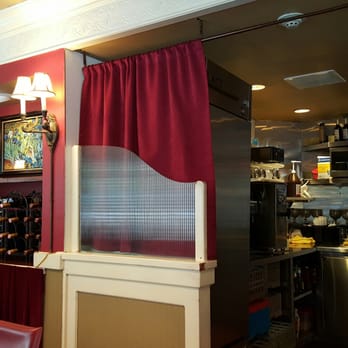 Russell's - Open kitchen. Wide wine selection. Comfortable lighting. Plays background classical music. Burgundy colored curtains and quaint lamps. - American Near Me - Pasadena, California Russell's - Open kitchen. Wide wine selection. Comfortable lighting. Plays background classical music. Burgundy colored curtains and quaint lamps. - American Near Me - Pasadena, California