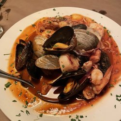 Cioppino served with crusty hot bread and a beautiful side salad with house made dressing.