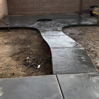 Jcs Concrete Services - fire place area we did with a Roman slate texture and curved edge - Masonry/Concrete Near Me Jcs Concrete Services - fire place area we did with a Roman slate texture and curved edge - Masonry/Concrete Near Me