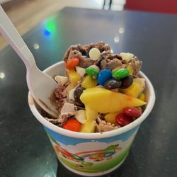 Absolute Zero - Thai Rolled Ice Cream. Check out the fresh Mango chunks! +White chocolate chips, M&Ms, and LOTS more choices.