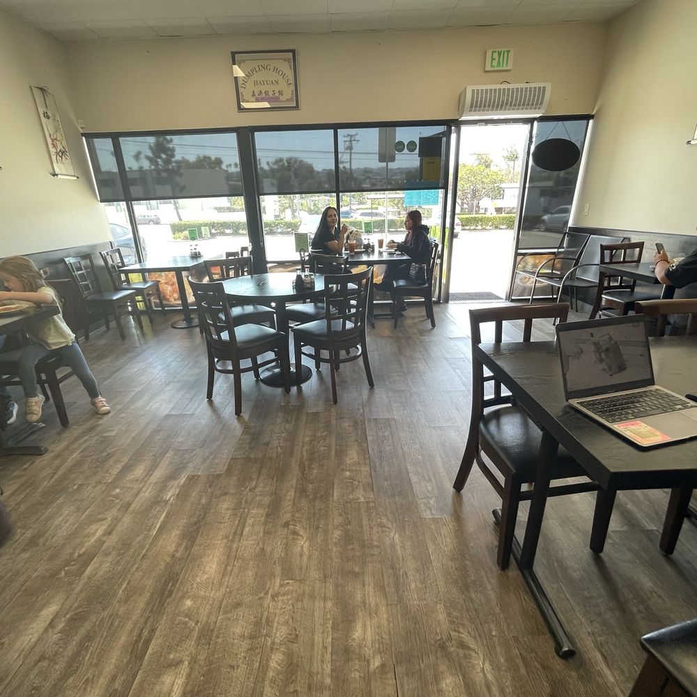 Jiayuan Dumpling House - Dining room, chairs for to go orders by the door. - Szechuan Near Me - Redondo Beach, California
