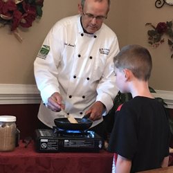 A Mighty Oak Bed and Breakfast - Todd showing my son how he makes bananas foster..