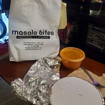 Masala Bites - Chicken vindaloo, with rice and two huge pieces of garlic naan. - Indian Near Me - Virginia Beach, Virginia