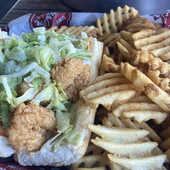 Uncle T's Oyster Bar - Shrimp po'boy with waffle fries instead of chips - Bars Near Me - Scott, Louisiana