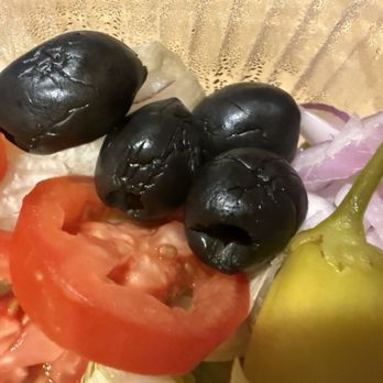 Olive Garden Italian Restaurant - Olive Garden salad. Black olives are old and dried up starting to go bad. Not something anyone wants to eat. - Italian Near Me - Eugene, Oregon