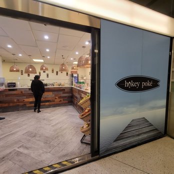 Hokey Poké - two people standing in front of a counter - Poke Near Me - New York, New York