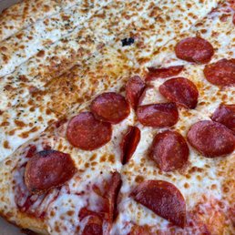 a pepperoni pizza in a box