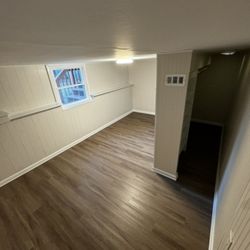 The Diligent Handyman - We tore out all of the walls and carpet to remediate mold. We installed new paneling and flooring and added a walk-in closet.
