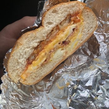 Hillside Delicatessen - a hand holding a sandwich - Delis Near Me - Mamaroneck, New York