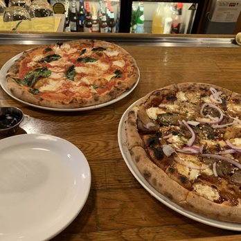 Fat Olives - The margherita pizza and the specialty Satchmo's pizza. - Pizza Near Me - Flagstaff, Arizona Fat Olives - The margherita pizza and the specialty Satchmo's pizza. - Pizza Near Me - Flagstaff, Arizona