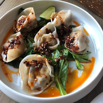 Madam - Mushroom dumplings - pea leaves, golden garlic, aromatic chili oil - New American Near Me - Birmingham, Michigan Madam - Mushroom dumplings - pea leaves, golden garlic, aromatic chili oil - New American Near Me - Birmingham, Michigan
