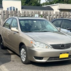 Vince's Auto Body Works - Work done to hood and side of car. Headlights were replaces as well and new bumpers.