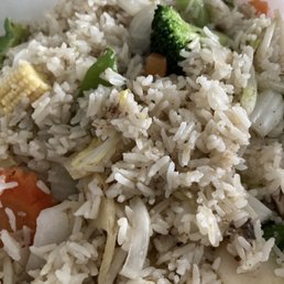 Veggie fried rice - Vegetable fried rice with broccoli, carrots, and cabbage, served in a bowl, highlighting a variety of cooked vegetables mixed with rice.