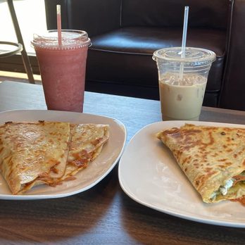 Ahadu coffee - Left: strawberry lemon refresher and turkey sundried tomato crepe. Right: Ahadu special with whole milk, veggie pesto crepe. - Coffee & Tea Near Me - Lee's Summit, Missouri