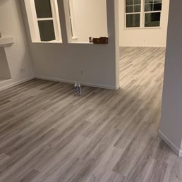 a living room with hardwood floors