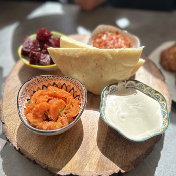 Bissli Grill - a variety of foods on a wooden board - Kosher Near Me - Boynton Beach, Florida