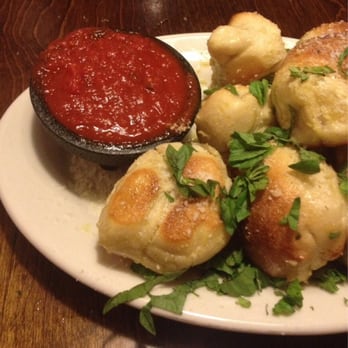 Five Points Pizza - Garlic Knots garnished with fresh chopped basil. The combination of the basil and garlic is delish on the wonderful bread!! - Italian Near Me - Nashville, Tennessee