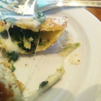 Paesanos - Fried ravioli not half eaten, but rather cut in half. - Italian Near Me - Davis, California