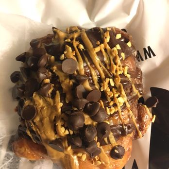 Voodoo Doughnut - Memphis Mafia Doughnut: banana fritter with a peanut butter drizzle and chocolate chips on top - Donuts Near Me - Austin, Texas Voodoo Doughnut - Memphis Mafia Doughnut: banana fritter with a peanut butter drizzle and chocolate chips on top - Donuts Near Me - Austin, Texas
