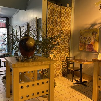 Caffe Casa - a table with a vase on it - Bakeries Near Me - Kalamazoo, Michigan