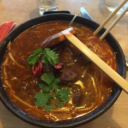 Noodle Zone - Pho Bo: rice noodles in a homemade oriental spiced, fragrant broth with slices of beef, pickled vegetables, and bean sprouts.