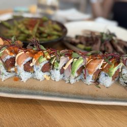Show Izakaya - Sunset Roll, perfect combination of flavors. Fresh Fish, amazing soft sheet crab, not too saucy. Overall, best roll there.