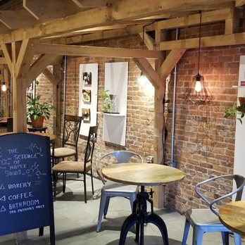 Catalyst Coffee Bar - Cute seating area with solid decor - Coffee & Tea Near Me - Saint Albans City, Vermont