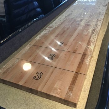 Topgolf - Shuffleboard table - New American Near Me - Edison, New Jersey Topgolf - Shuffleboard table - New American Near Me - Edison, New Jersey