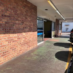 Wash & Fold Dry Cleaner & Laundromat - Front