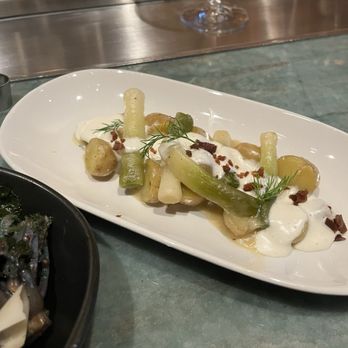 Crossroads Kitchen - Baby Leeks and News Potatoes 7/10 Umaro bacon / dill sour cream - Vegan Near Me - Las Vegas, Nevada Crossroads Kitchen - Baby Leeks and News Potatoes 7/10 Umaro bacon / dill sour cream - Vegan Near Me - Las Vegas, Nevada
