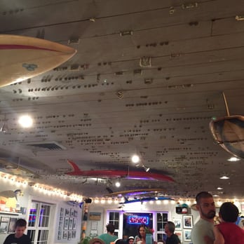 Surfin' Spoon - Money is collected in the ceiling as a tradition since the 50's and donated to charity - Ice Cream & Frozen Yogurt Near Me - Nags Head, North Carolina