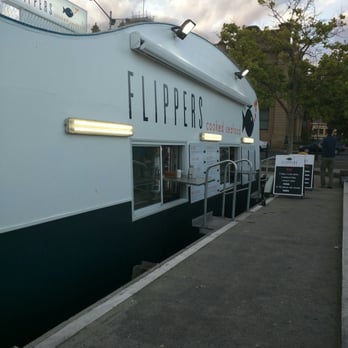 Flippers Cooked & Fresh Seafood - Just a boat on the water... Shaped like a fish - Seafood Near Me - Hobart, TAS
