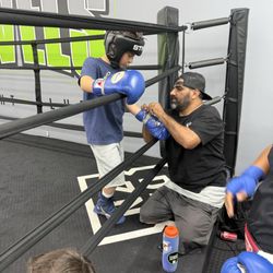 Levels Fight Club - Coach Eli working with one of the amateur boxers
