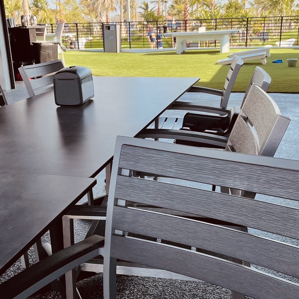 PopStroke - Patio view of the course. Beautiful warm weather and cool cross breeze. - Mini Golf Near Me - Lutz, Florida PopStroke - Patio view of the course. Beautiful warm weather and cool cross breeze. - Mini Golf Near Me - Lutz, Florida