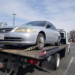 Budge Towing - Transporting  a vehicle too Dealership.