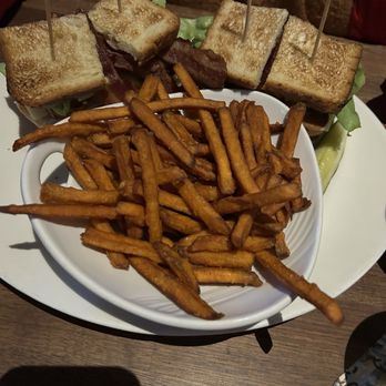 Yard House - Stacked Turkey Club, with bacon & avocado. Served w sweet potato fries - New American Near Me - Kansas City, Missouri Yard House - Stacked Turkey Club, with bacon & avocado. Served w sweet potato fries - New American Near Me - Kansas City, Missouri