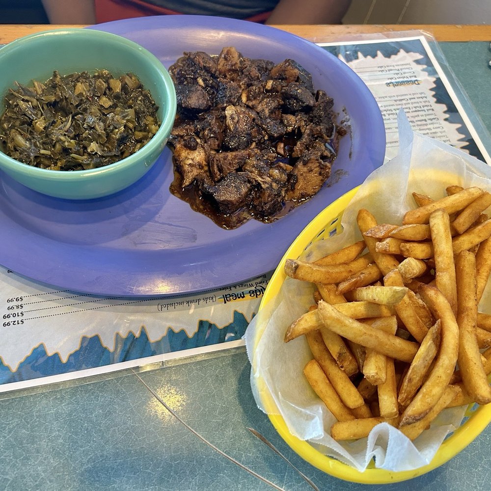 Jerk pork Fries Greens