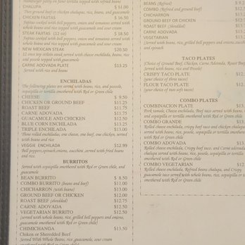 El Comal - A menu board from El Comal in Santa Fe, NM, listing Mexican dishes such as tacos, burritos, and enchiladas with prices, including options like chile relleno and huevos rancheros. - Mexican Near Me - Santa Fe, New Mexico