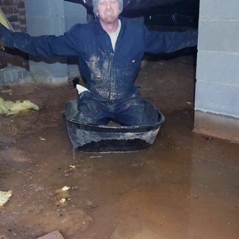 Scout's Pest Control - Chad enjoying a ride in a wheelbarrow under a flooded home - Pest Control Near Me - Greenville, South Carolina Scout's Pest Control - Chad enjoying a ride in a wheelbarrow under a flooded home - Pest Control Near Me - Greenville, South Carolina