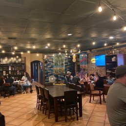 people sitting at tables and eating