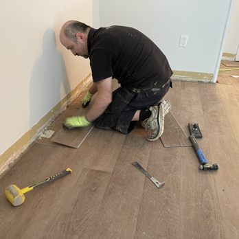 Esthete Home Services - a man working on the floor - Flooring Near Me - Vancouver, British Columbia