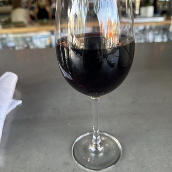 Zinburger - Gilbert is packed, but managed to find this outdoor bar seat for Luna and I.  Erath Pinot Noir (9 oz pours). - Burgers Near Me - Gilbert, Arizona
