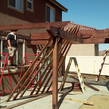 North Star Development - a man working on a pergol roof - General Contractors Near Me North Star Development - a man working on a pergol roof - General Contractors Near Me