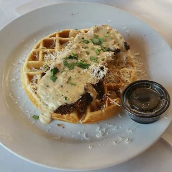 Pie 314 Everyday Eatery - Pecan crusted chicken and white cheddar waffle with maple bacon syrup and bourbon gravy. - Pizza Near Me - Lewisville, Texas