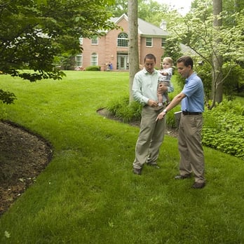 SavATree Mountainside - two men playing frisbee in the yard - Tree Services Near Me - Mountainside, New Jersey