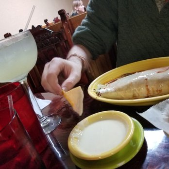 Puerto Vallarta - a man eating a fish and chips - Mexican Near Me - Muncie, Indiana