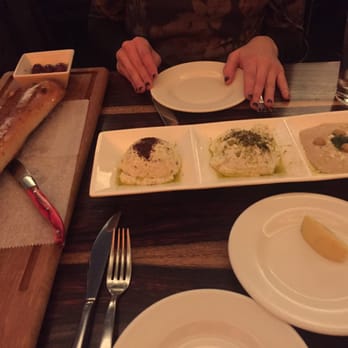 Bustan - Mezze. From left to right- spicy feta, tzatZiki, hummus - Mediterranean Near Me - New York, New York Bustan - Mezze. From left to right- spicy feta, tzatZiki, hummus - Mediterranean Near Me - New York, New York
